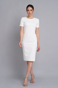 A minimalist dress featuring pencil silhouette, short sleeves, and a midi length. - scoop neck - fitted sheath silhouette - short sleeves - princess seams - midi length - concealed back zipper closure - fully lined The outer fabric : 40% viscose, 55% polyester, 5% elastane. The lining : 57% Viskose, 35% polyester, 8% elastane. Care: cold hand wash with similar colour. Please choose from our measurements chart your dress size, or write us your body measurements, we then select the right size for Fitted Minimalist Midi Dress, Minimalist Fitted Midi Dress, White Short Sleeve Midi Dress For Work, Classic Bodycon Short Sleeve Midi Dress, Modern Fitted Midi Dress With Short Sleeves, Classic Bodycon Midi Dress With Short Sleeves, Elegant Cap Sleeve Bodycon Dress, Elegant White Fitted Short Sleeve Dress, White Fitted Short Sleeve Elegant Dress