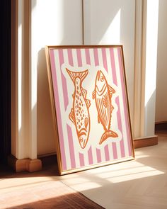 two fish are standing next to each other in front of a striped painting on the floor