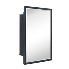 a mirror mounted to the side of a wall next to a black frame and light