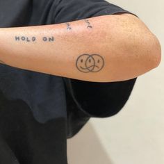 a person with a tattoo on their arm