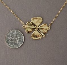 This four leaf clover pendant is molded from a real clover on a 14k gold fill chain. Clover is made with a gold overlay and will not change color if taken care of. A sterling silver chain and rhodium overlay option is also available. Pendant is 1 inch in width. You can choose the length you want when you checkout. If you want a size smaller than 16 inches, let me know when you checkout. You can add an extension chain to your necklace by adding this item to your cart: https://www.etsy.com/listing Nickel Free Yellow Gold Flower Pendant Jewelry, Nickel-free Yellow Gold Flower Pendant Jewelry, Nickel-free Gold Flower Pendant Jewelry, Gold Hypoallergenic Flower Pendant Jewelry, Hypoallergenic Gold Flower Pendant Jewelry, Classic Gold Jewelry For Good Luck, Gold Four Leaf Clover, Four Leaf Clover Necklace, Clover Pendant