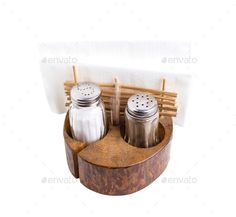 two salt and pepper shakers in a wooden container on a white background - stock photo - images