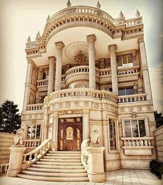 an elaborately designed building with stairs and statues on the front porch, in sepia