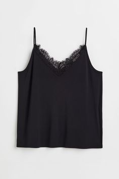 Camisole top in jersey. Extra-narrow shoulder straps and low-cut  lace-trimmed V-neck at front and back. Camisole Outfit, Workwear Capsule Wardrobe, Workwear Capsule, Capsule Wardrobe Checklist, Capsule Wardrobe Women, Lace Trim Cami Top, Black Cami Top, Lace Trim Cami, Stockholm Style