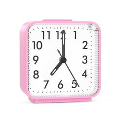 a pink and white clock with numbers on the face is shown in front of a white background