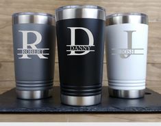 three personalized tumblers sitting on top of a table