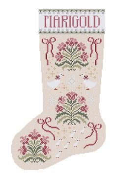 a cross stitch christmas stocking with the word margod on it's side