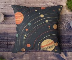 a pillow with an image of the planets on it