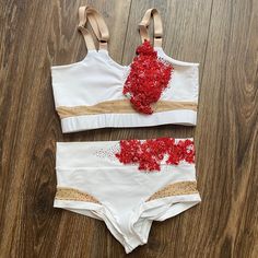 two piece swimsuit with red sequins on the bottom and white bra top