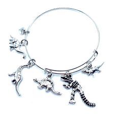 New Dinosaur Themed Charms Are Made From A Zinc Alloy Metal (Lead And Nickel Free) Charms Are Approx 1/2” - 1” In Size Expandable Bracelet Is Made Of Steel Is Smooth And Comfortable Inside Diameter Is 2.5” ***May Be Personalized With Initial And Or Birthstone For Extra Please Message Me Prior To Purchase Last 4 Photos Show Personalization Add $2.00 For Initial $3.00 For Birthstone Or $4.00 For Both Birthstone And Initial*** Dinosaur Bracelet, James Avery Bracelet, Beachy Bracelets, Vintage Bangle Bracelets, Lovers Bracelet, Locket Bracelet, Awareness Bracelet, Bow Bracelet, Energy Bracelets