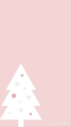 a white christmas tree on a pink background with polka dots and snow flecks