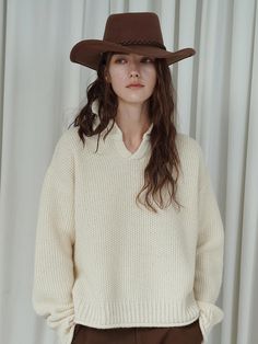 This luxurious open-collar sweater combines the casual appeal of a polo shirt with the warmth of a premium wool-alpaca blend, featuring a naturally fuzzy texture for ultimate comfort. The unique Kaneko double-sided structure and 5-gauge knitting technique elevate its craftsmanship, while the relaxed silhouette ensures versatile wearability. Available in a sophisticated beige shade, this piece offers a perfect balance of style and comfort with its thoughtfully designed free size that accommodates Cream Knit Polo Sweater For Fall, Fall Beige Wool V-neck Sweater, Cozy Beige Polo Sweater For Fall, Fall Beige Polo Sweater With Ribbed Collar, Beige Ribbed Collar Polo Sweater For Fall, Winter Sweater With Ribbed Johnny Collar, Winter Sweater With Johnny Collar And Ribbed Details, Collared Cream Polo Sweater For Winter, Cream V-neck Winter Sweater For Work