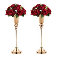 two gold vases with red roses on them