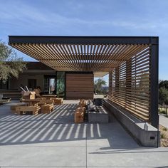 an outdoor patio with wooden slats on the roof