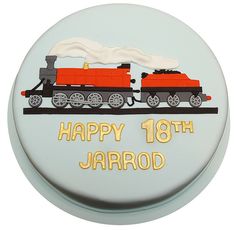 a birthday cake with an image of a train on the side and happy 18th jarrod written in gold