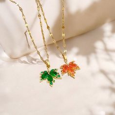 Add a touch of nature's beauty to your look with this exquisite Red Maple Leaf Necklace.  🌿✨ Featuring a delicate acacia leaf pendant and a versatile green clavicle chain, this piece is perfect for adding an autumnal flair to your style or gifting to someone special. Its romantic, girly design brings elegance to any outfit, making it an ideal accessory for both casual and formal occasions. Key Features: 🍂 Nature-Inspired Design: Beautiful red maple leaf pendant symbolizing the charm of autumn. Red Nature-inspired Jewelry For Gifts, Nature-inspired Orange Jewelry For Gifts, Nature-inspired Orange Jewelry Gift, Hypoallergenic Leaf-shaped Jewelry Gift, Green Leaf-shaped Necklace For Gift, Maple Leaf Necklace, Red Maple Leaf, Girly Design, Romantic Gifts For Her