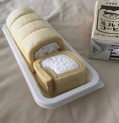 a cake in the shape of a car on a bed next to a box of rice