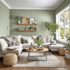 a living room with green walls and white furniture in the corner, along with potted plants