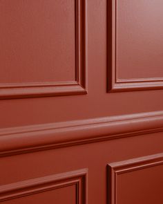 a red door with two handles on it