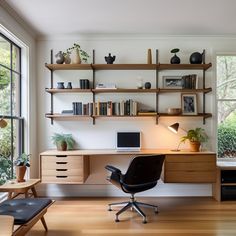 a home office with shelves, desk and chair in front of large window overlooking trees