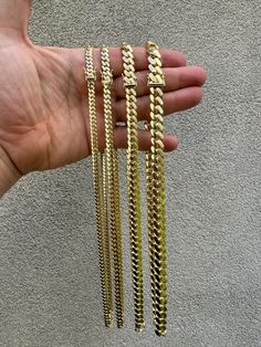 Gorgeous mens handmade cuban link chains 
Made in USA - by a 3rd generation Cuban jeweler! Perfectly filed down and polished
Hangs perfectly straight - doesn't kink or twist! Best cubans you will find anywhere - Guarantee that!
Very tight links - no gaps at all
 
Available in 5mm-10mm (this is chain thickness...it measures 2-4mm bigger at clasp)
Box lock clasp
Great for pendants or wear alone!
 
HEAVY SOLID 14k gold...not plated or filled...not hollow
IMPOSSIBLE TO RIP! Luxury 14k Gold Cuban Link Necklace, Luxury 14k Gold Cuban Link Necklace With Curb Chain, 14k Gold Cuban Link Necklace With Curb Chain, Polished Yellow Gold Cuban Link Jewelry, Luxury 14k Gold Cuban Link Necklace With Box Chain, Luxury Cuban Link Necklace With Figaro Chain, Cuban Link Curb Chain Necklace, 14k Gold Cuban Link Curb Chain Jewelry, 14k Gold Cuban Link Necklace With Polished Finish