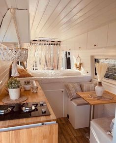 the interior of a tiny house with wood flooring