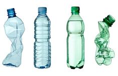 four different types of water bottles lined up side by side on a white background with one empty bottle in the middle