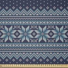 a knitted blue and white pattern with hearts