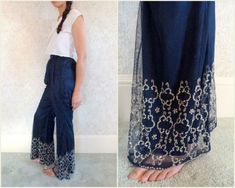 Rare vintage beaded trousers (unsure of the decade they were made).  Pants have a sheer overlay w/beading on the wide legs.  There is a clasp & zipper on the left waist and the back waist has elastic and can stretch. Some of the beads on hem are missing (can send additional photos). Model is 5'9" 32-28-38 Visit Our Shop https://www.etsy.com/shop/MirrorballBoutique LABEL: N/A  MATERIAL: Satiny fabric, Sheer Mesh, Beads COLOR: Navy, Silver beads SIZE/FIT: N/A  WAIST: 12" - 15" (stretched) HIPS: 20 Traditional Embellished Bottoms For Party, Traditional Embellished Party Bottoms, Blue Summer Bottoms For Festive Occasions, Blue Summer Festive Bottoms, Blue Festive Summer Bottoms, Summer Festive Blue Bottoms, Embroidered Bottoms For Summer Wedding, Embellished Fitted Bohemian Bottoms, Bohemian Embellished Fitted Bottoms