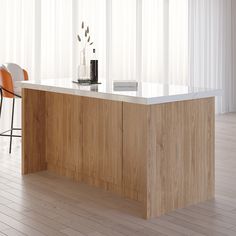 a modern kitchen with an island counter and bar stools