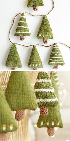 several knitted christmas trees hanging from strings