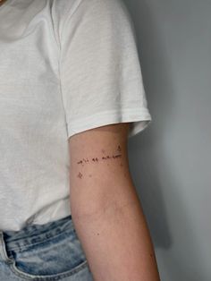 a woman's arm with writing on it