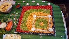 a table topped with lots of different types of food and snacks on top of it