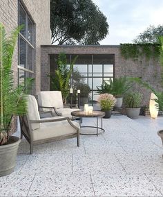 an outdoor patio with potted plants and chairs on the floor, next to a brick wall