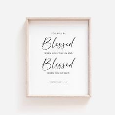 a white framed sign with the words, you will be blessed when you come in and blossom