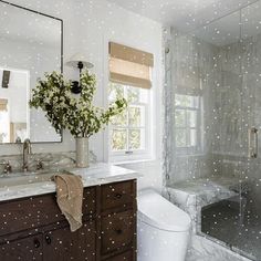 a bathroom with white speckles on the walls