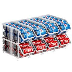 six cans of coca - cola stacked on top of each other in a metal rack