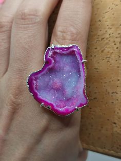 Introducing our stunning Geode Rings - nature's hidden treasures transformed into exquisite jewelry! Each Geode Ring showcases the unique beauty of geodes, with their captivating crystals and vibrant colors. Elevate your style and connect with the Earth's natural wonders. Discover the magic of geodes with our Geode Rings today! 🔸Adjustable band ring  🔸30mm stone size 🔸Color may vary according to lighting 🔸Silver filled We offer  🔸Fast shipping  🔸Free shipping eligible orders 🔸Polishing cl Unique Open Ring With Raw Stone, Unique Round Gemstone Geodes, Unique Crystal Open Ring With Stone Setting, Agate Open Ring Jewelry, Agate Gemstone Open Ring Jewelry, Agate Jewelry With Natural Stones In Open Ring Shape, Agate Gemstone Open Ring, Agate Ring With Large Stone, Unique Agate Crystal Ring Gift