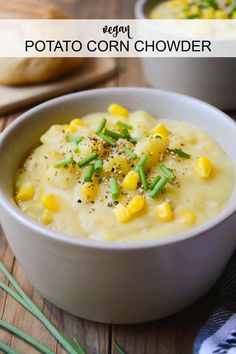 two bowls filled with potato corn chowder on top of a wooden table