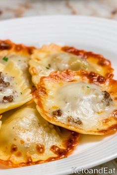 some ravioli with meat and cheese on a white plate