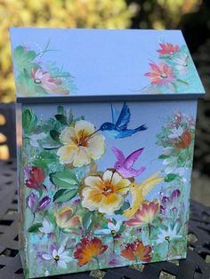 a painted box sitting on top of a table