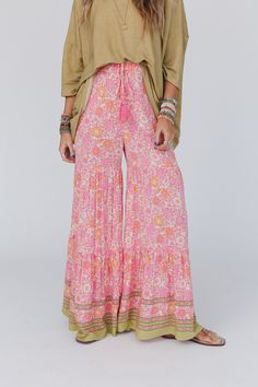 You are going to love the Kimmie Wide Leg Palazzo Pant - trust us! These pants are the perfect blend of boho and comfort, making them a must - have because they feature: Boho Rayon Crinkle fabric that drapes beautifully and adds a touch of texture Border floral print for an eye - catching look Tiered design that adds movement and flow to your every step Palazzo silhouette with wide legs for a relaxed and breezy feel Elastic waistband with tassel tie detail for a customizable and comfortable fit Rayon Crinkle, Womens Palazzo Pants, Strap Pants, Palazzo Pant, Tassels Decor, Embroidered Denim Jacket, Wide Leg Palazzo Pants, Fun Life, Boho Pants