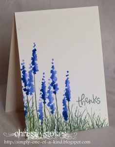 a greeting card with blue flowers on it