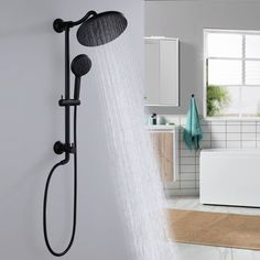 a shower head and hand held shower faucet in a bathroom