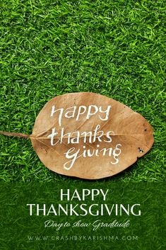 a happy thanksgiving card with a leaf on green grass and the words happy thanksgiving giving