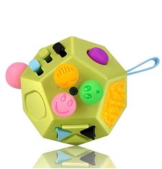 the toy is shaped like a hexagonal object with different colored shapes and sizes