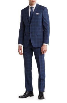 Give your reputation a clean slate with a modern tailored plaid suit featuring a classic notch lapel jacket and flat front trousers. Jacket has notched lapels; chest welt pocket; patch pockets Trousers have zip fly with button closure; front slant pockets; back button-welt pockets 70% wool, 13% polyester, 15% Tencel, 2% linen Dry clean Imported Model stats: 6'1" height, 32" waist. Model is wearing size 40R. Plaid Suit Men, Blue Plaid Suit, Windowpane Suit, Flannel Suit, Lapel Jacket, Clean Slate, Plaid Suit, Navy Suit, Men’s Suits