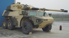 an armored vehicle parked in front of a building