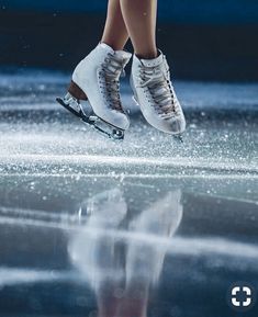 the legs and feet of a person skating on ice