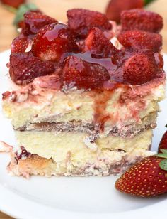 there is a piece of cake with strawberries on it